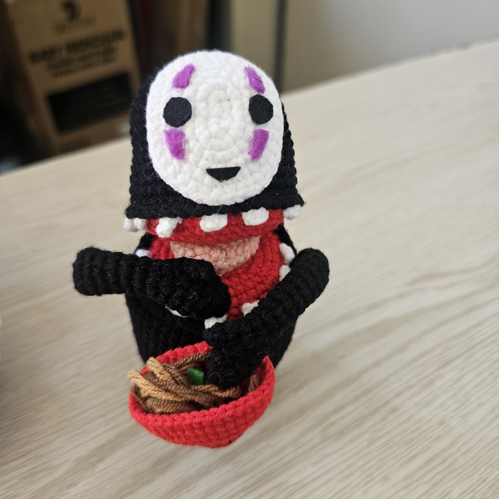 Crochet No-Face Figure with Red Bowl